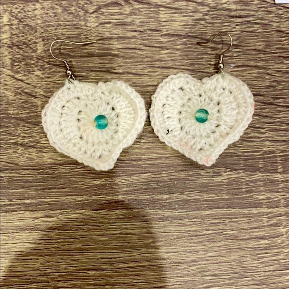 White heart earrings with a blue beed
